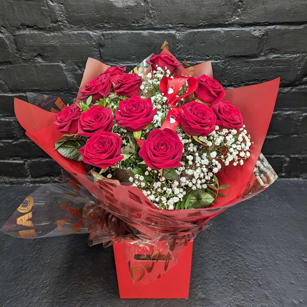 The Hidden Language of Flowers in Scotland 12 red roses hand-tied bouquet with Gypsophila in red wrap and gift box – Anastasia Florists Aberdeen