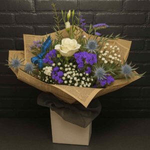 Scottish Thistle & Rose Bouquet with white roses, thistles, purple flowers and Gypsophila wrapped in vintage newspaper paper with tartan ribbon – Anastasia Florists Aberdeen