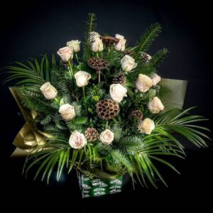 Elegant Christmas flower arrangement with white roses