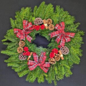 Red tartan pine Christmas door wreath with pinecones, lotus pods and cinnamon
