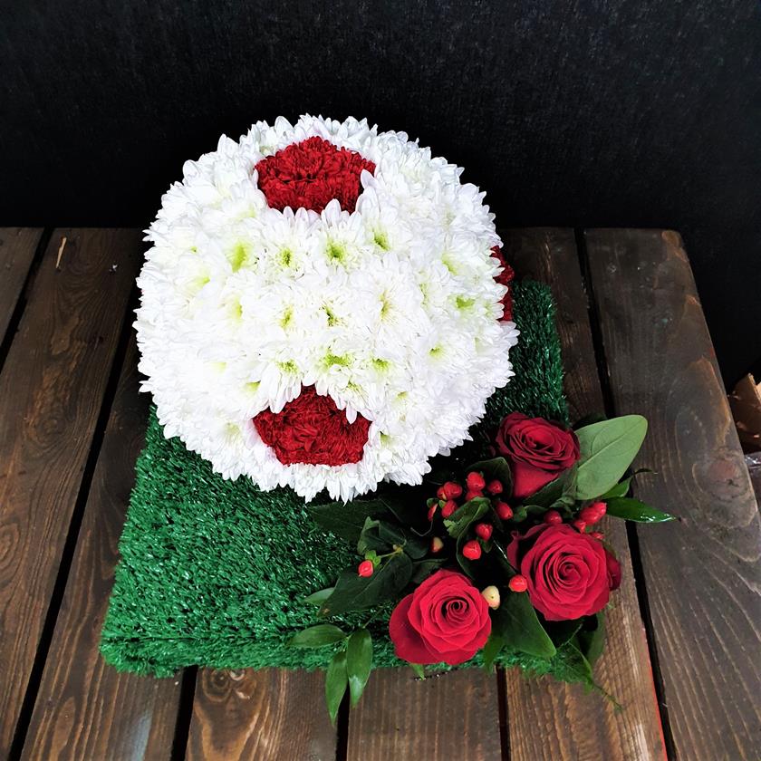 Football Funeral Tribute with White Roses Floral football tribute with white roses and greenery – side view