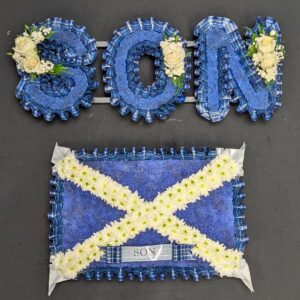 Scottish funeral flowers arrangement with tartan