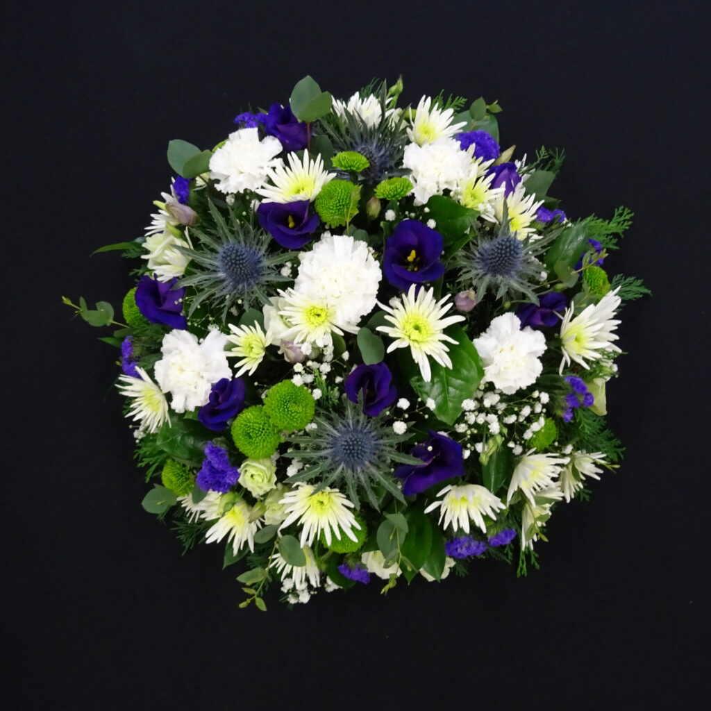 Aberdeen Funeral Home Directory & Delivery Guide White and purple funeral posy tribute with mixed flowers