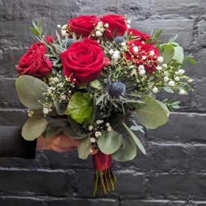 Bridal bouquet with red roses and greenery