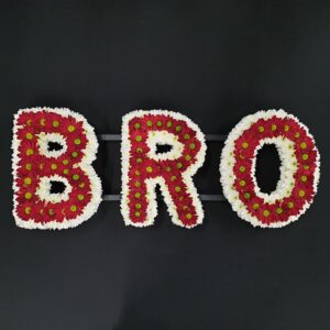 Letter tribute red and white flowers B R O