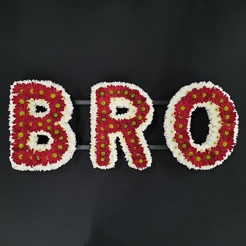 Letter tribute red and white flowers B R O
