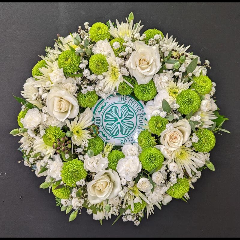 Celtic Football Club themed funeral wreath with green and white flowers.