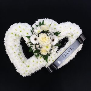 Double open heart funeral tribute with white flowers