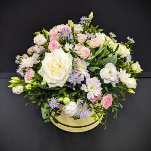 pastel flower arrangement in a hat box