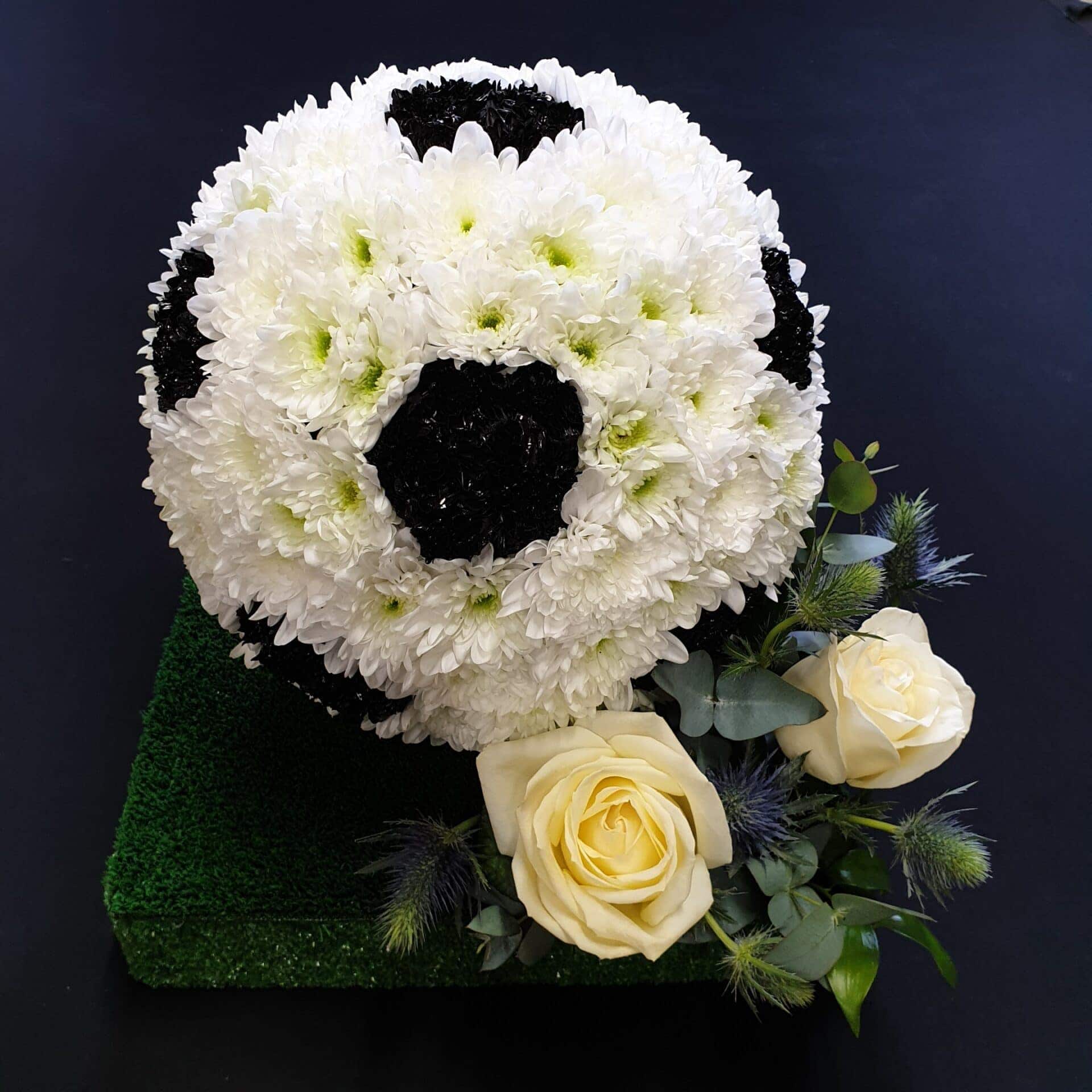 Football Funeral Tribute with White Roses Floral football tribute with white roses and greenery