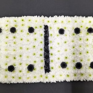 Floral domino tribute with white and black flowers