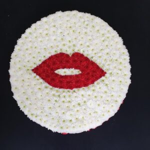 Funeral Kiss floral tribute with red and white flowers