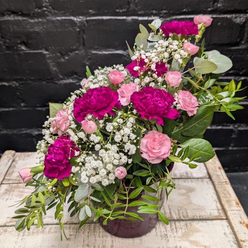 How do I make flowers last longer? Heather Stylish Pot arrangement with greenery in a purple container – Anastasia Florists Aberdeen