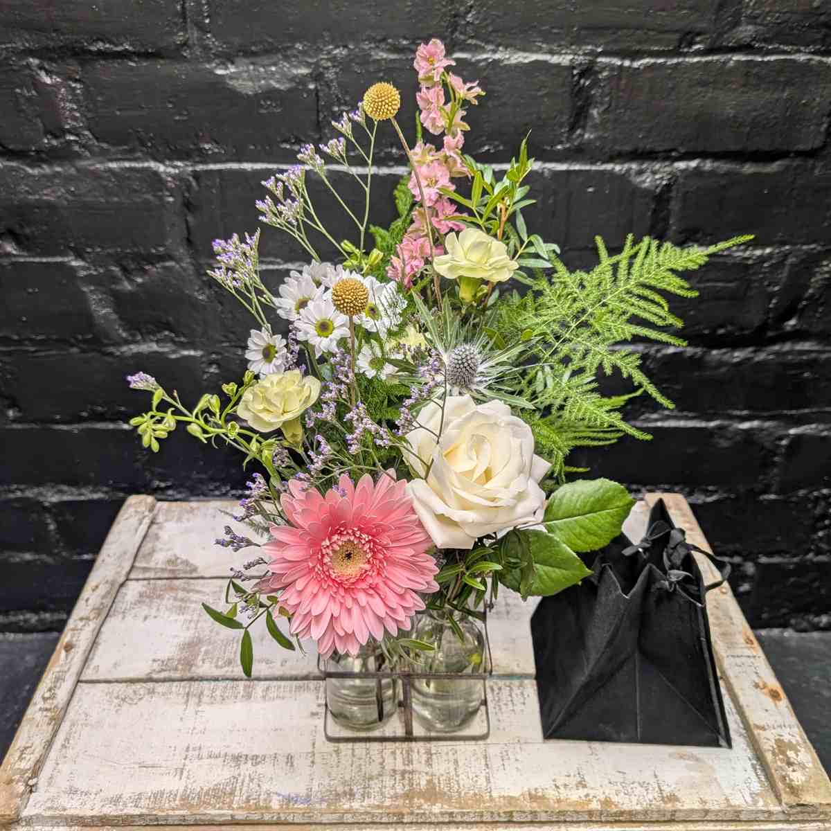 Charming bouquet in vintage-style milk bottles