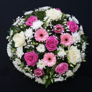 Pink and white funeral posy with pink gerberas, pink and ivory roses and white chrysanthemums