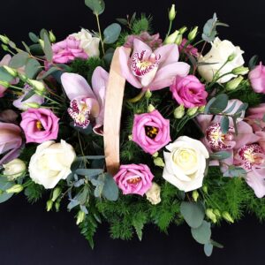 Pink and white funeral flower basket arrangement