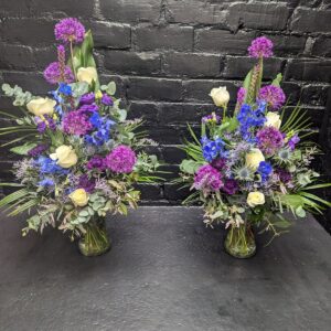 Purple and white floral funeral arrangement – side view