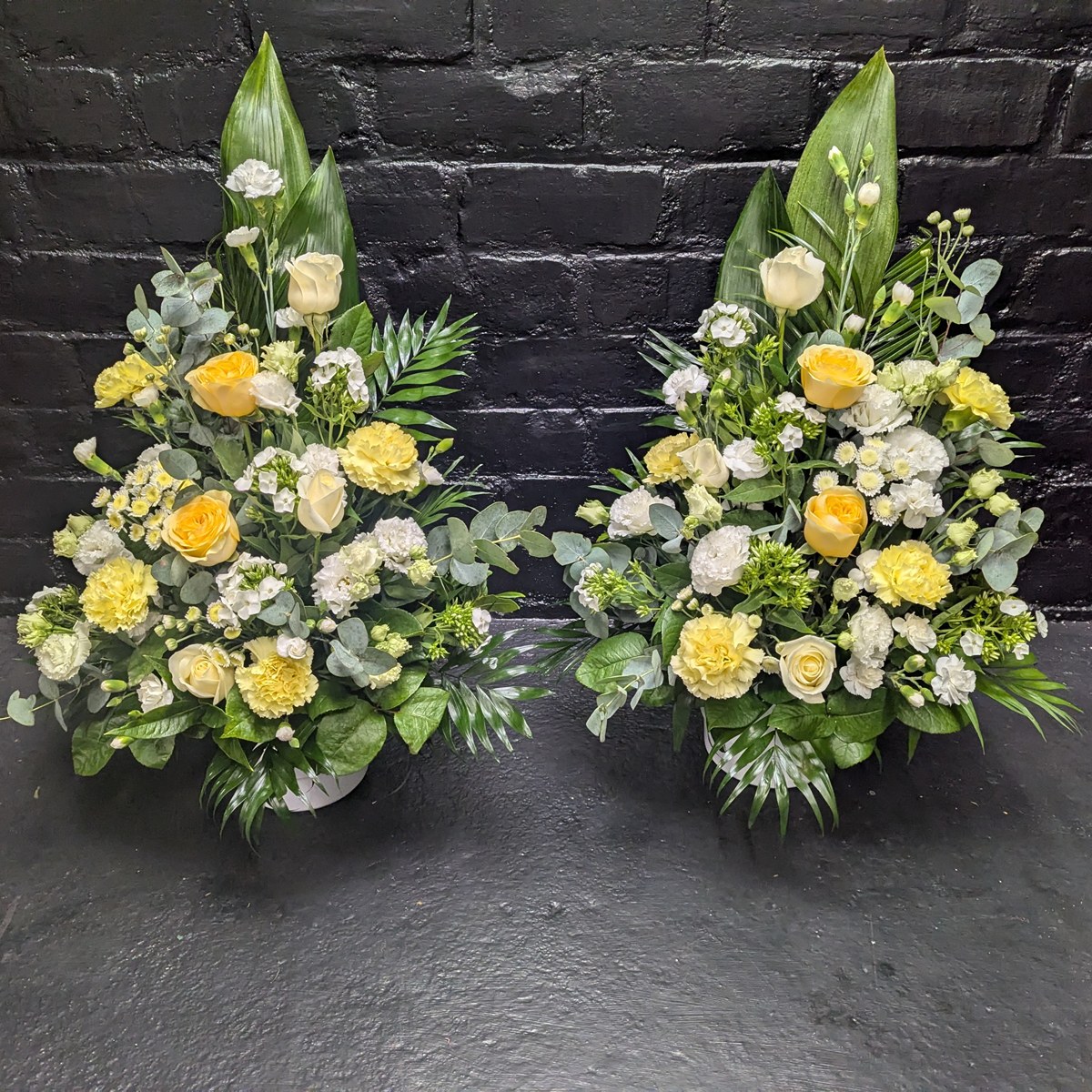Yellow rose and foliage funeral arrangement – close-up