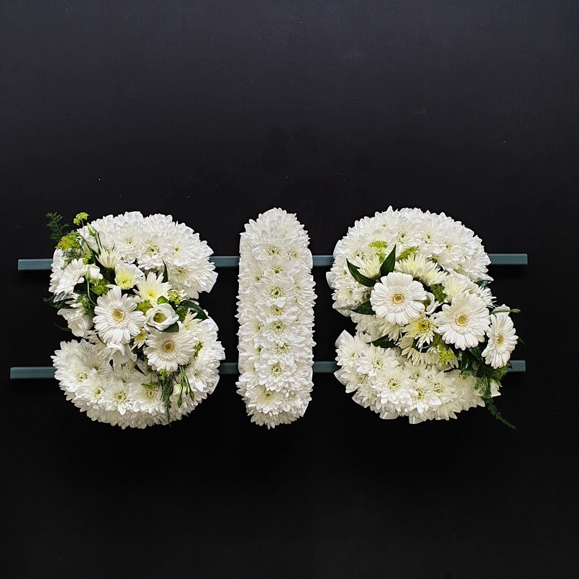 SIS funeral letter tribute in all white chrysanthemums and gerberas