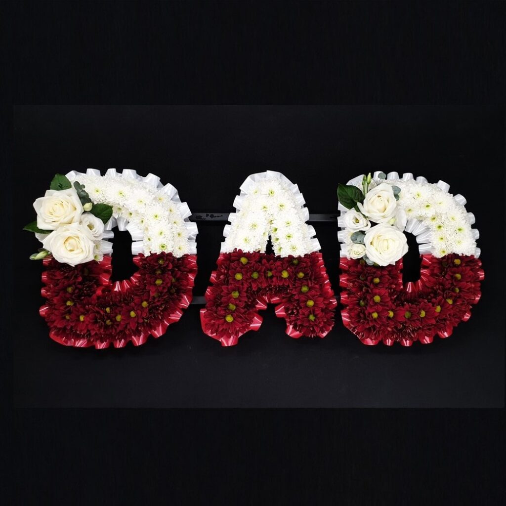What Flower Arrangements are Suitable for a Male Funeral? Two-tone red and white DAD funeral letter tribute with chrysanthemums and white roses