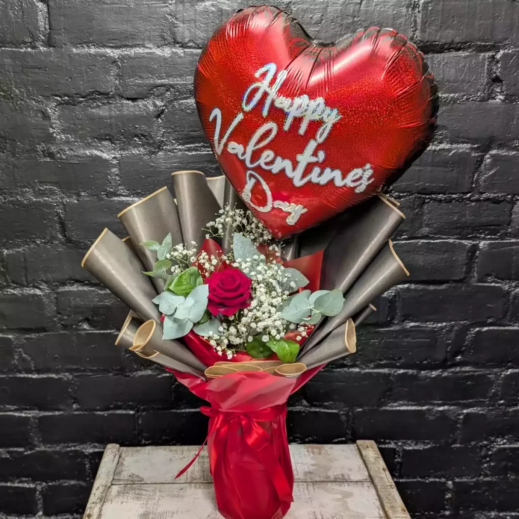 Valentine’s Day Flowers Aberdeen 2026 | Anastasia Florists Valentine’s single red rose bouquet with heart-shaped “Happy Valentine’s Day” balloon from Anastasia Florists Aberdeen