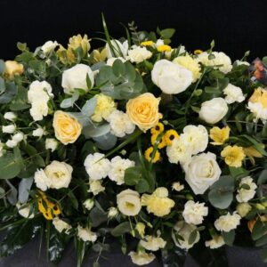 Yellow and cream coffin spray with roses and carnations