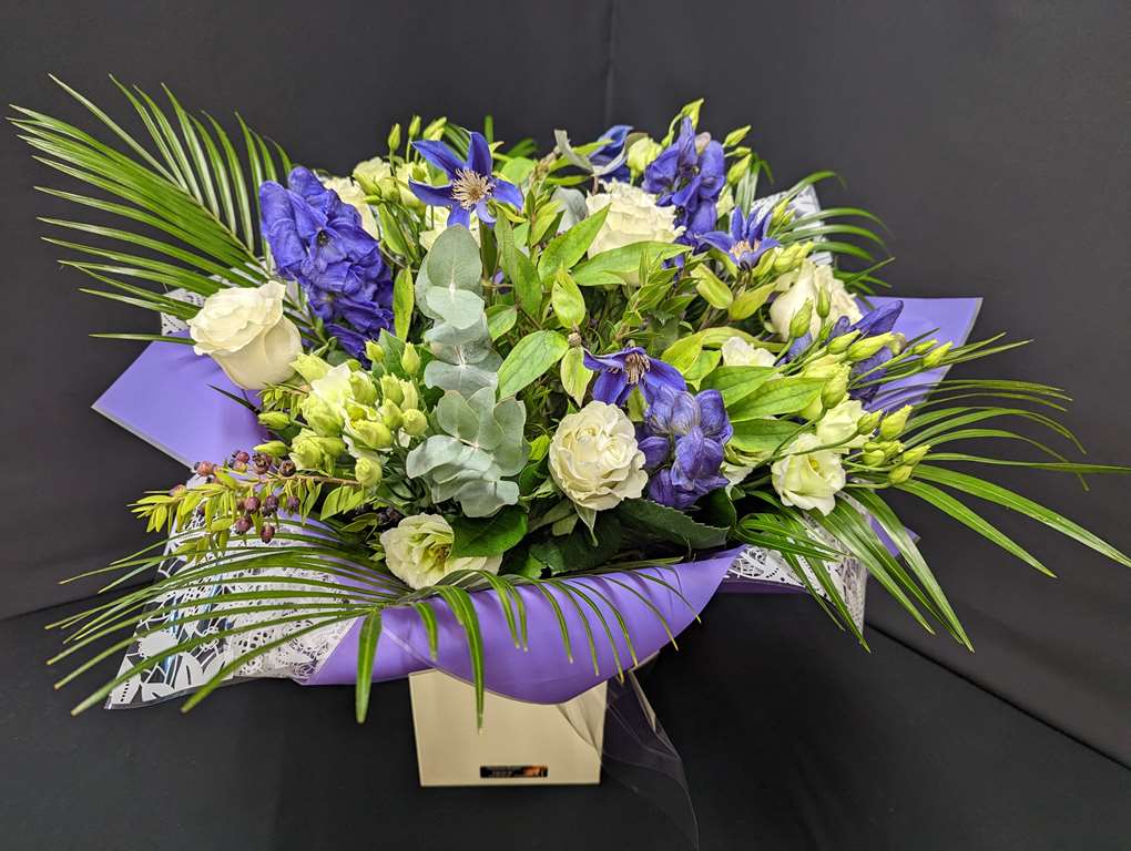 White Roses and Blue Flower Bouquets