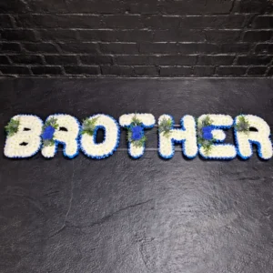 Brother funeral letter tribute in blue and white flowers displayed on a frame