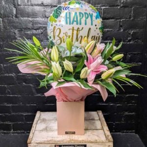 Anastasia Florists — Your Aberdeen Florist Since 1995 Pink and white oriental lily gift box with Happy Birthday balloon, palm and eucalyptus, in a blush pink box" — Media Library title: "Pink & White Lily Birthday Balloon Gift Box – Anastasia Florists Aberdeen