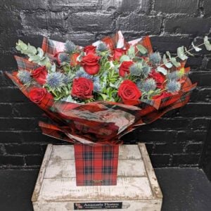 Tartan Rose and Thistle Bouquet — red roses and blue thistle in tartan wrap, Anastasia Florists Aberdeen