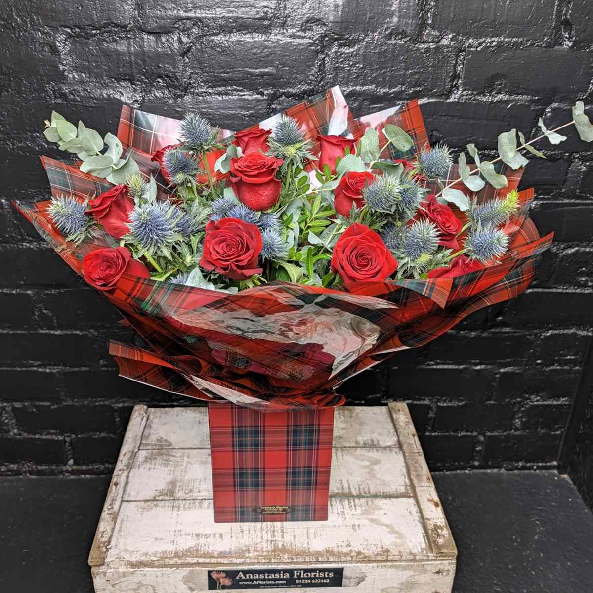 Tartan Rose Thistle Bouquet Tartan Rose and Thistle Bouquet — red roses and blue thistle in tartan wrap, Anastasia Florists Aberdeen