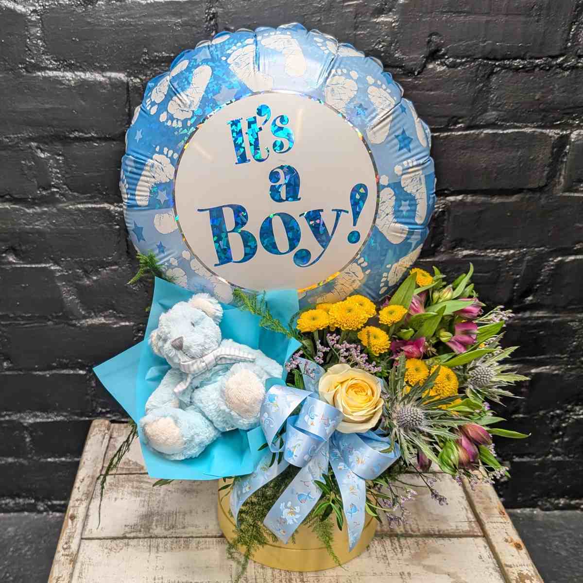 Baby Boy Gift Set 3 Baby boy gift set with teddy bear and flowers – side view