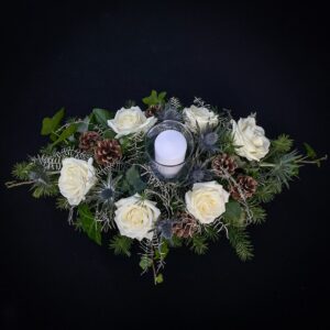 White rose and pine cone Christmas centrepiece