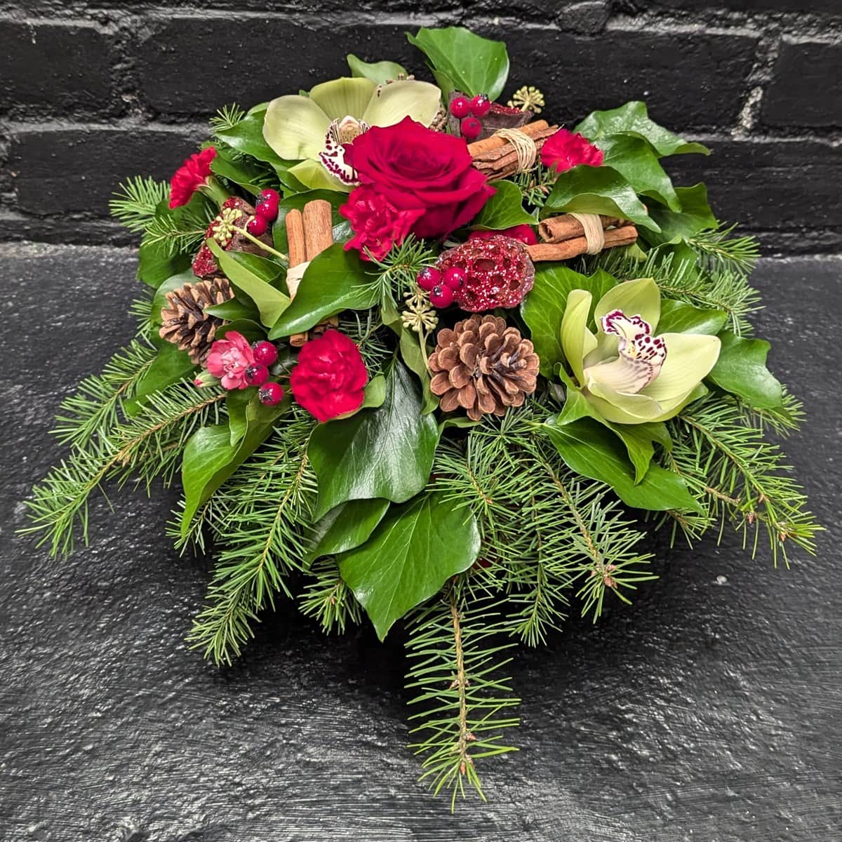 Christmas Hat Box 1 Festive flower arrangement in Christmas hat box.