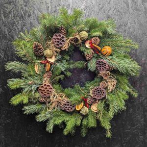 Traditional Christmas wreath with pine cones and dried fruits