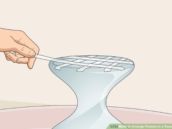 Man Add Clear Tape Over the Top of The Vase
