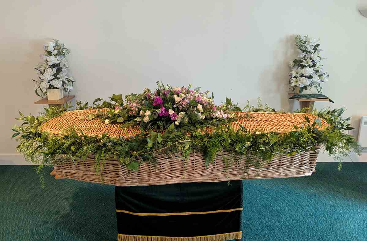 Funeral Casket Spray Garland 2 Funeral casket garland with flowers and greenery – close-up