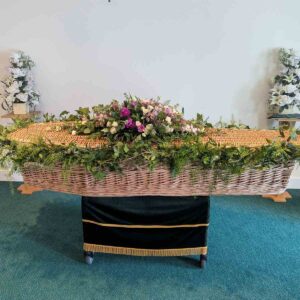 Funeral casket garland with flowers and greenery