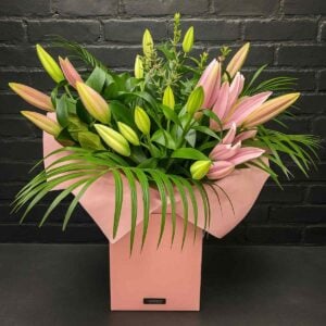 Lilly Valley flower bouquet with pink lilies and greenery