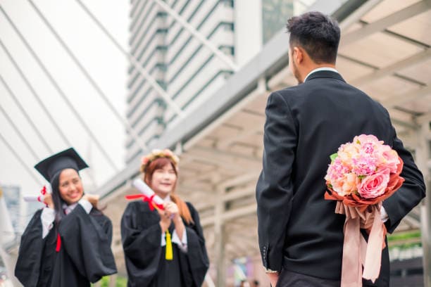 Man Surprising Woman Graduated with Bouquets in Aberdeen
