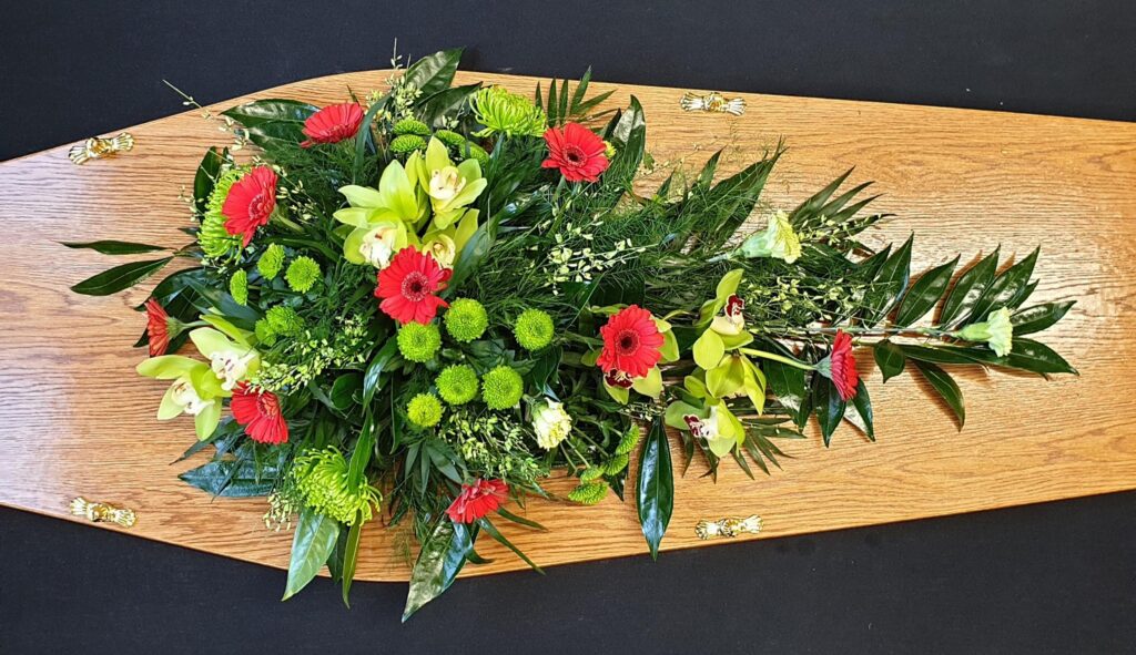Beautiful Flowers Casket Wreaths in Front of Coffin