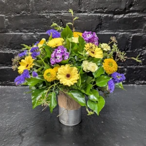 Tin of Seasonal 2025 3 Colourful arrangement of seasonal flowers in a tin – angle view