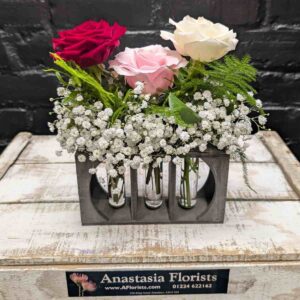 Trio of Roses Trio of roses arrangement in individual glass vases – arrangement detail