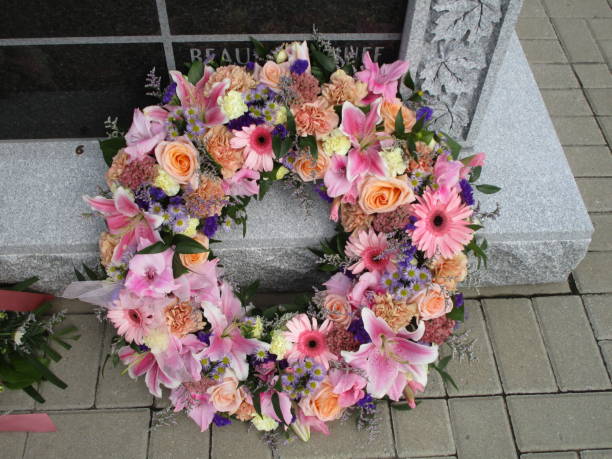 A pink wreath on a tomb