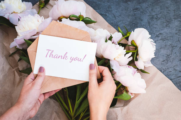 A flower gift delivered with a "Thank You" message