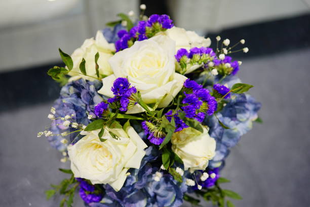 A bouquet of white and purple flowers