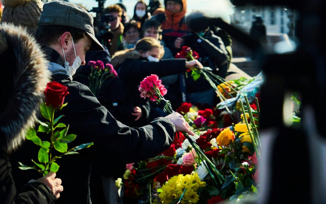 a man arrange funeral flowers